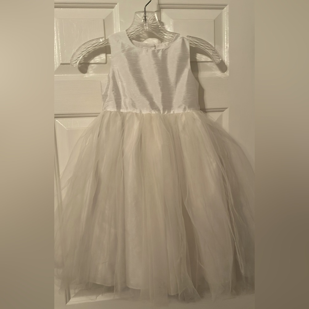 Girls flower girl dress. Cream colored satin with six layers for fullness.